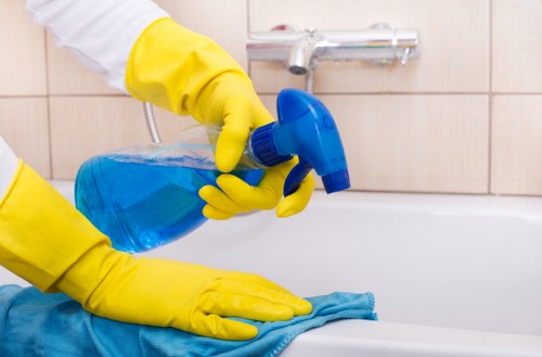 Cleaner removing fine dust from a renovated Crystal Palace kitchen