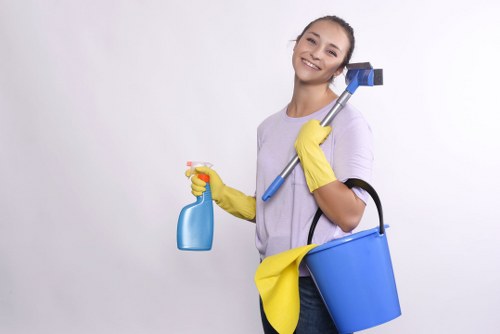Team using safe techniques for handling cleaning equipment